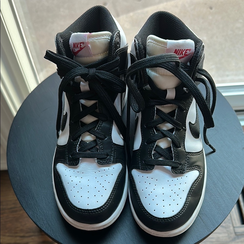 Unisex. Gently used. Black and white Nike Panda High Tops.